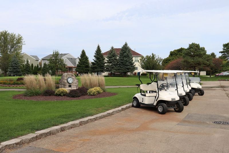 view of golf course with golf carts